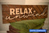 Relax and Unwind Sign with Fence Background